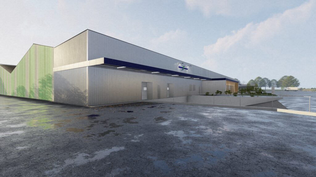 Entrepôt industriel moderne avec parking et ciel bleu.